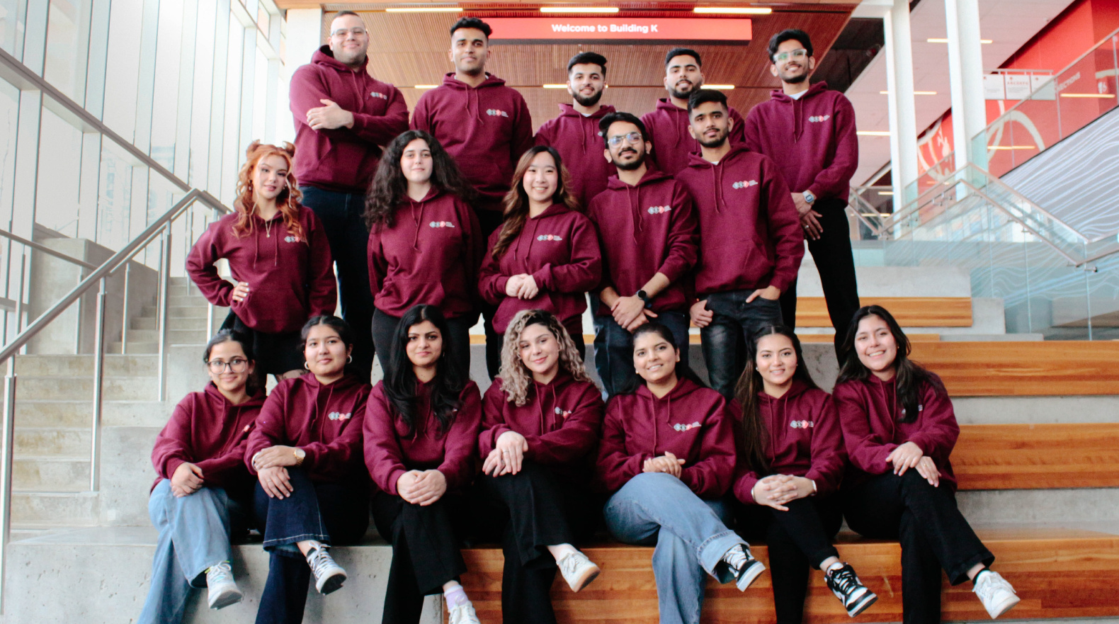 A group of students wearing the Seneca Student Federation hoodie posing for a group picture