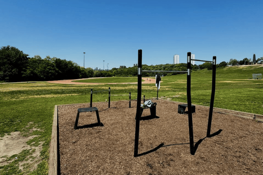 Photo of riverdale park from bar and rining court with the blue sky and green nature.