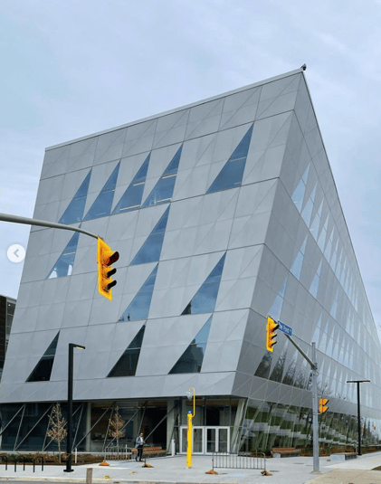 "York University School of Continuing Studies building exterior with students walking"