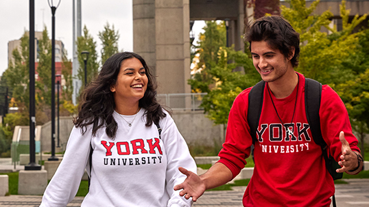 Girl and boy wearing york university hoodies