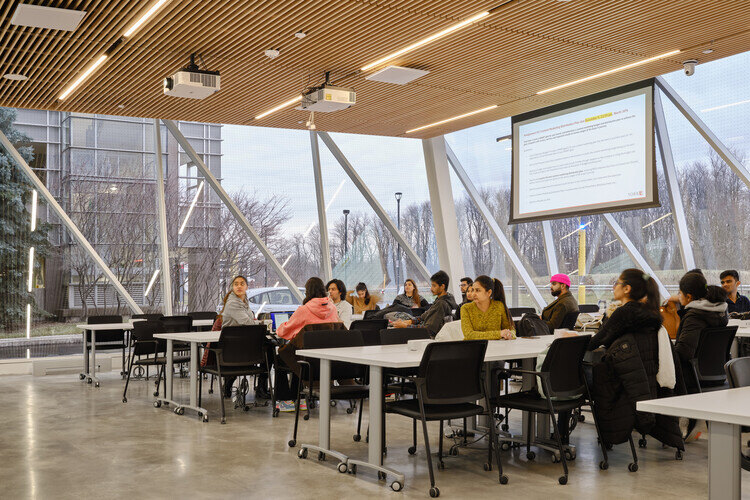 Students keenly looking at the presentation boards.